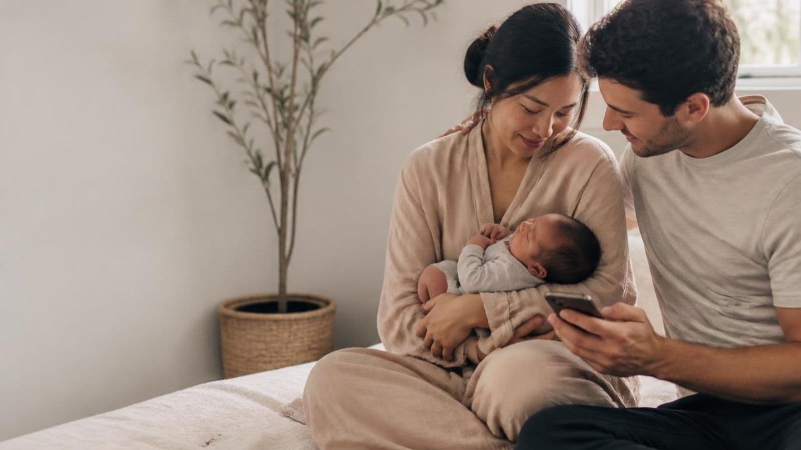 New parents sharing a quiet moment with their baby